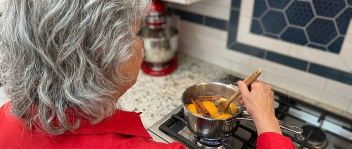 Anisa cooking in a cast iron pan