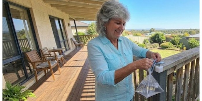 Anisa on her porch overlooking the countryside